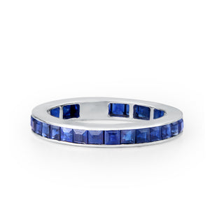 Shop blue sapphire channel-set ring in white gold at DiraLondon.com