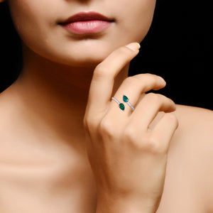 Pear-shaped double-head emerald and diamond ring