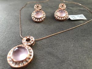 Rose quartz and diamond pendant in rose gold
